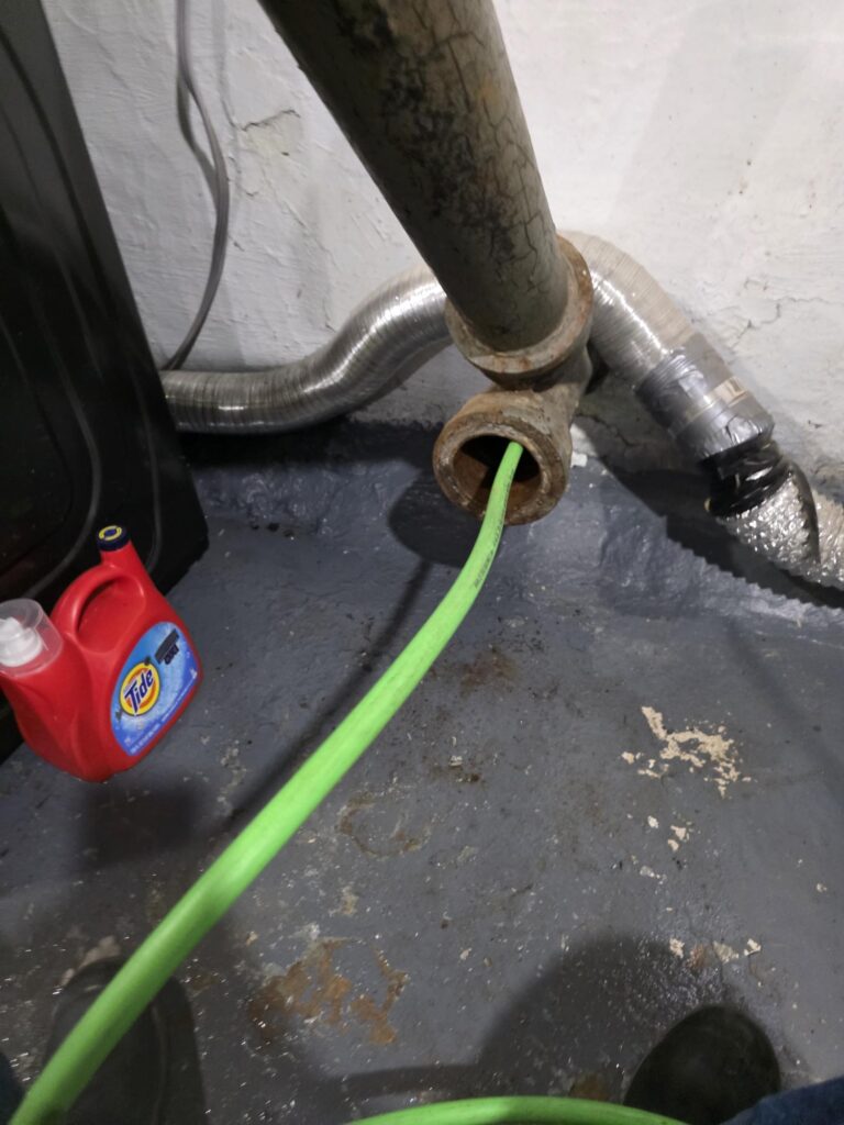 basement floor drain backing up caused by sewer line blockage in Burlington Iowa